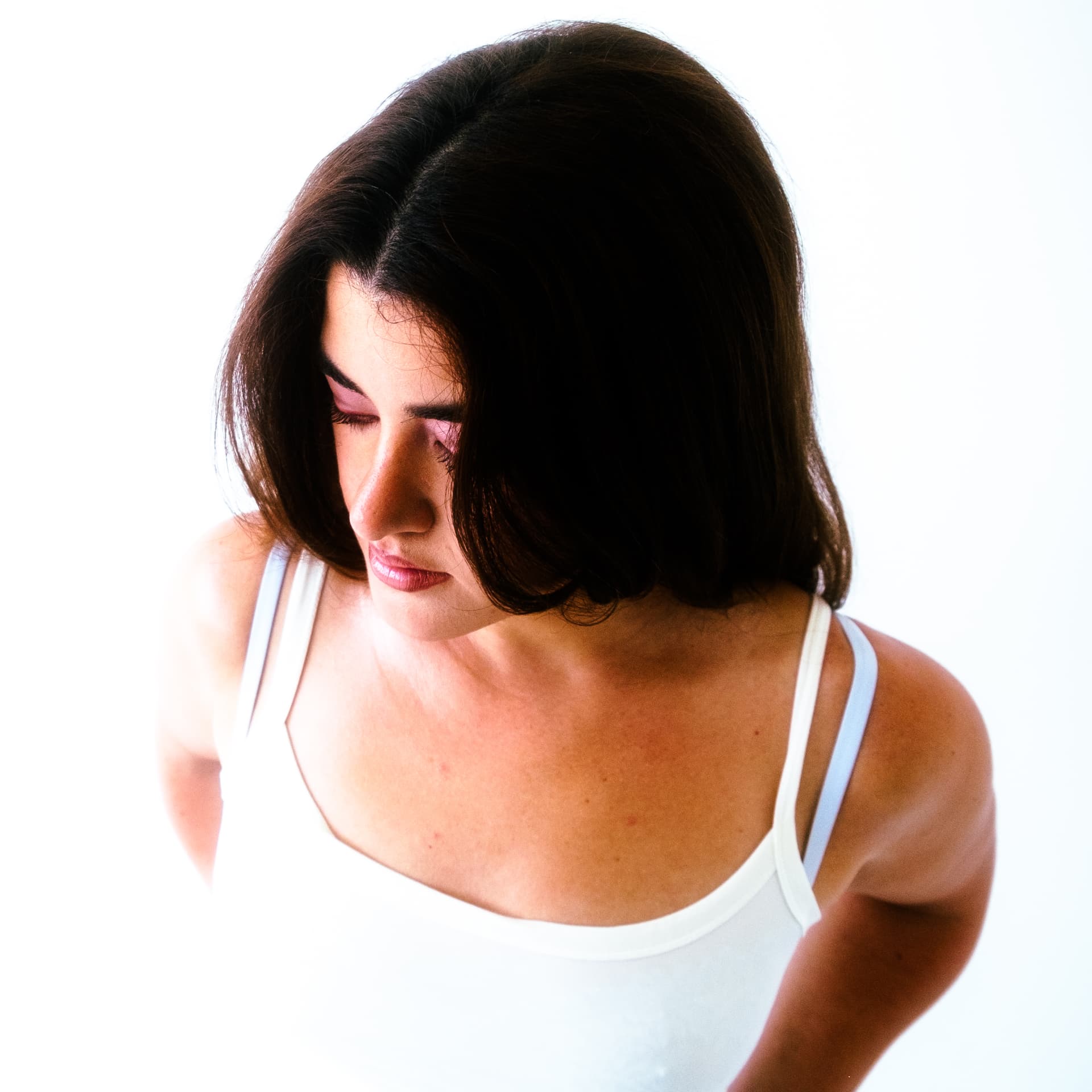 Leeza Maroe looking down in bright light