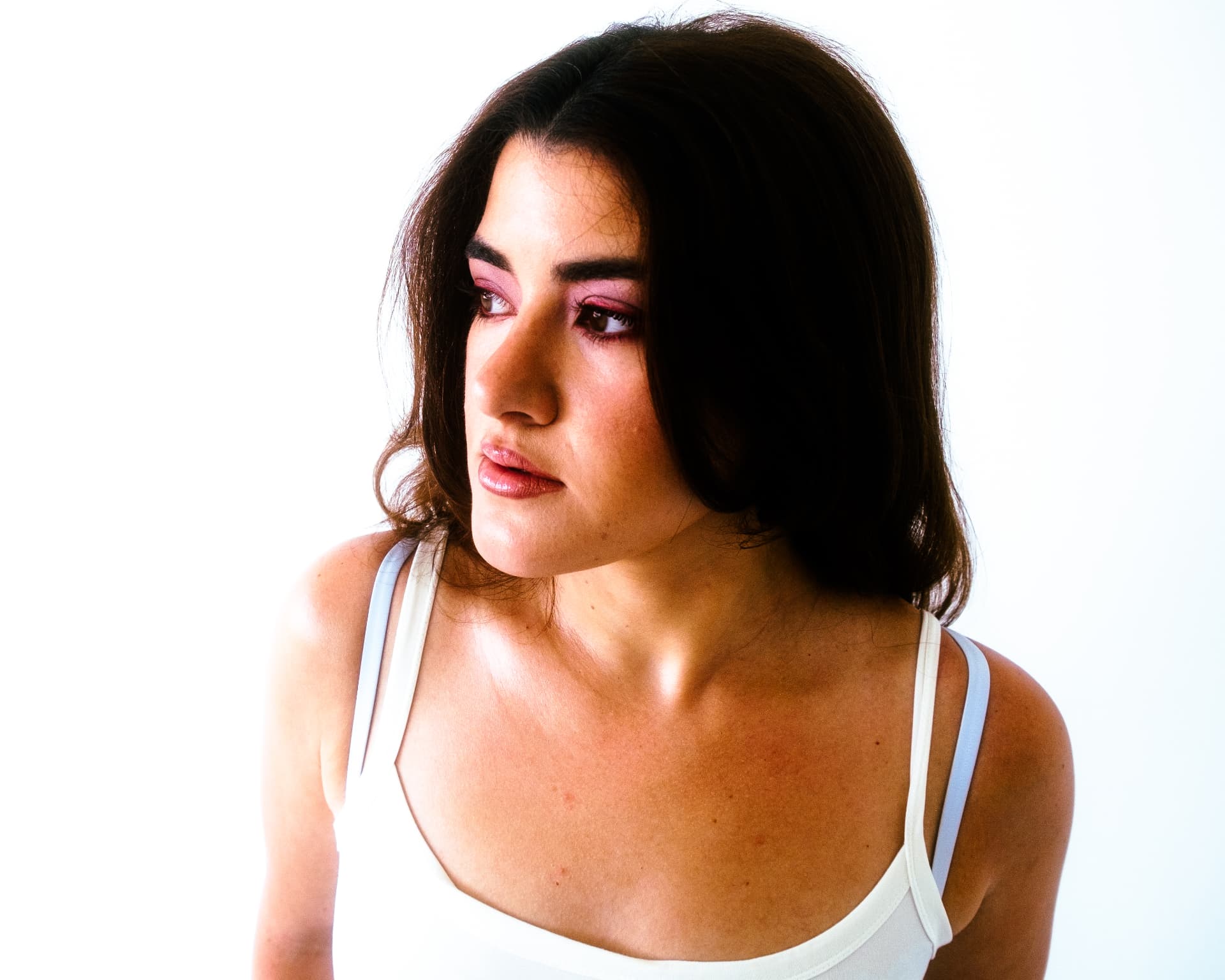 Leeza Maroe in a white top against a bright backdrop