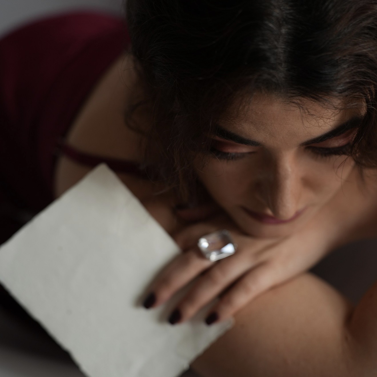 Close portrait of Leeza Maroe resting on her arm